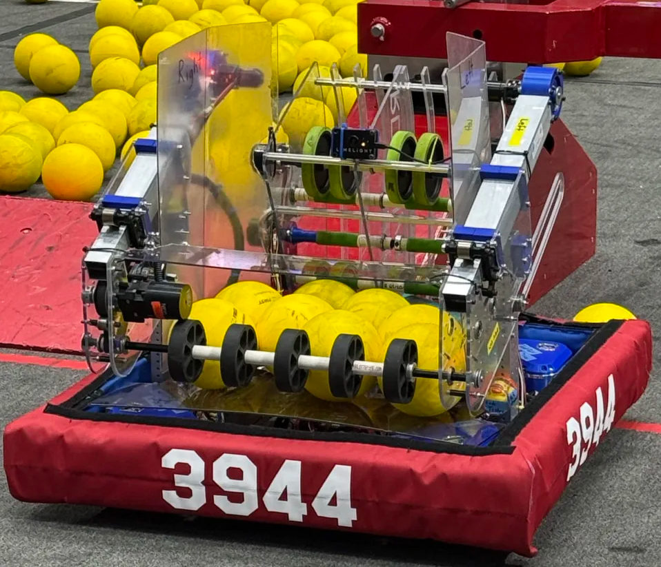 ROBOdysseus collecting yellow fuel on the 2026 REBUILT field